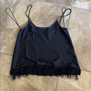 Black silk top with feather bottom trim on front